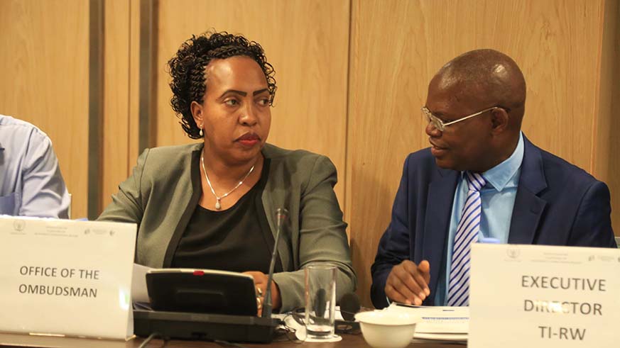 The Deputy Ombudsman, Odette Yankurije, chats with Transparency International Rwanda Executive Director Appolinaire Mupiganyi during the launch of the online platform in Kigali yesterday. Sam Ngendahimana.