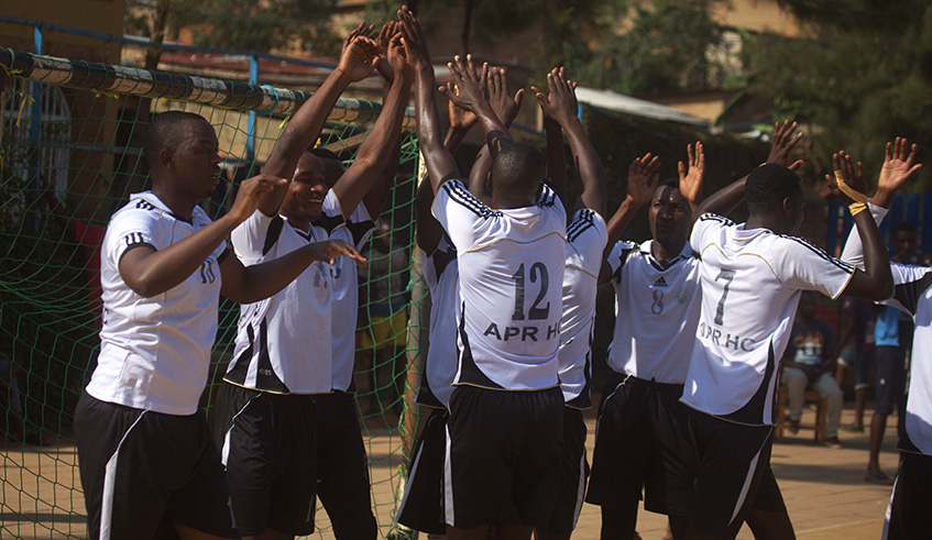 APR handball players celebrate  after scoring a goal against Police during last seasonu2019s final game of the national championship at Kimisagara Youth Centre. Sam Ngendahimana.