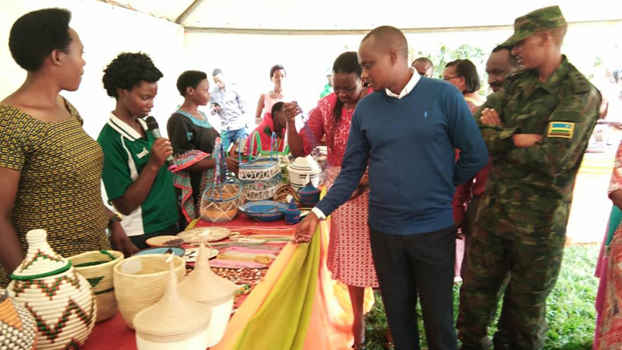 Mayor Murenzi and other officials tour the womenu2019s cooperative products at Rukara, Kayonza District on Thursday. Jean de Dieu Nsabimana.