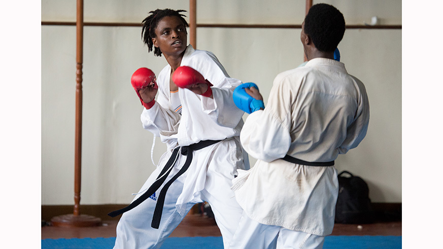 Solange Ingabire Gashagaza (middle) poses with other medal winners after clinching a gold medal in a past national karake championship at Amahoro Stadium. Courtesy.