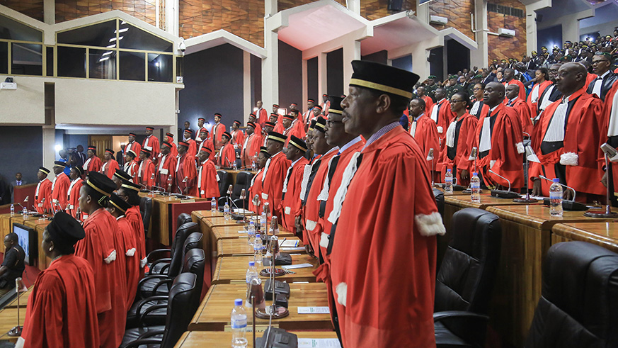 Judges sing the National Anthem just before the opening of the 2018-2019 Judicial Year at the Parliament yesterday. Nadege Imbabazi.
