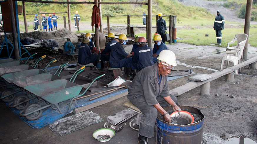 A mine worker filters mining products. File