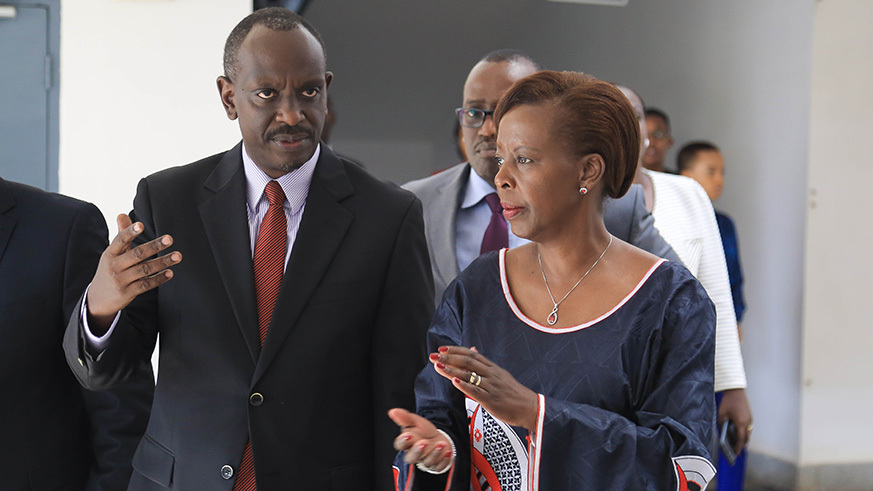 Staff with the Ministry Foreign Affairs look on during the handover ceremony. 