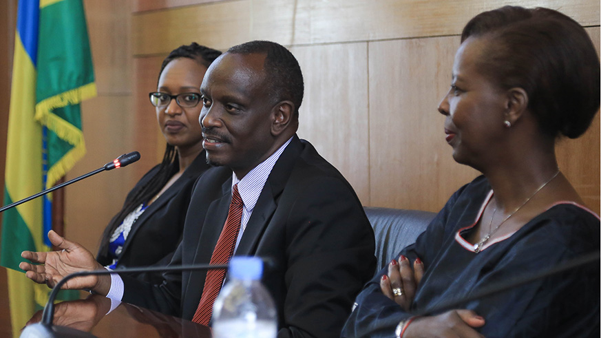 Outgoing Foreign Affairs Minister, Louise Mushikiwabo shows Dr. Richard Sezibera around his new offices after the handover ceremony.