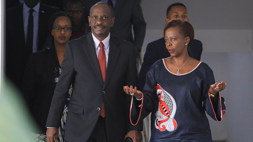 Outgoing Foreign Affairs Minister, Louise Mushikiwabo shows Dr. Richard Sezibera around his new offices after the handover ceremony.