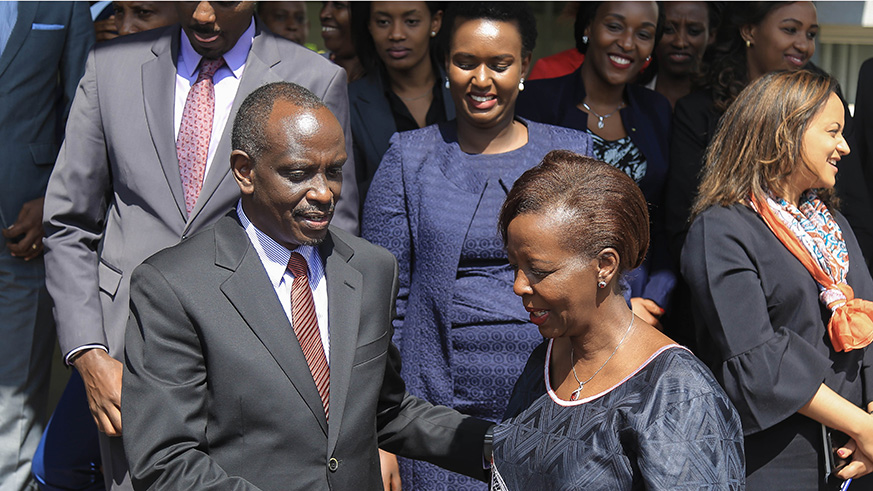Dr. Richard Sezibera and Louise Mushikiwabo share a light moment before staff. 