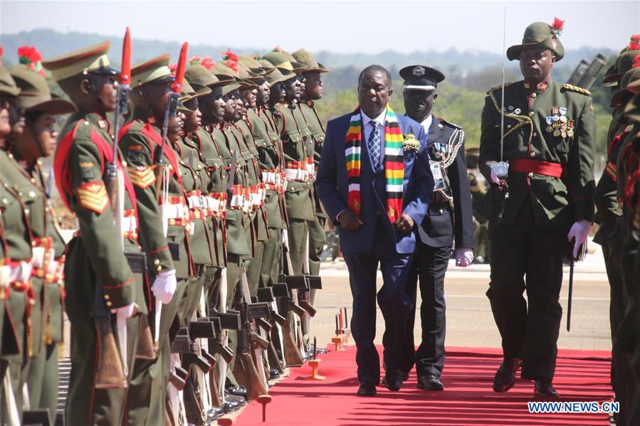Zimbabwean President Emmerson Mnangagwa (3rd R) inspects the guard of honor in Lusaka, Zambia
