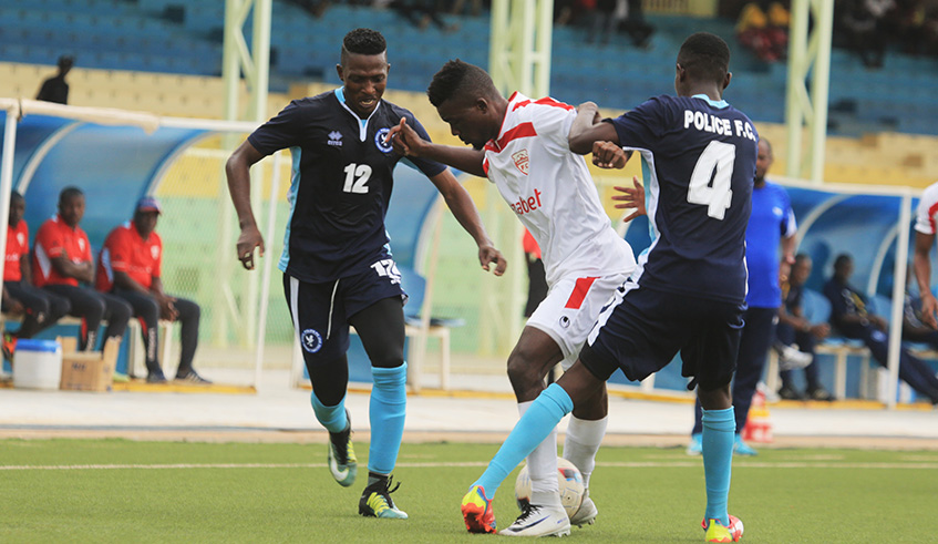 Police FC left-back JMV Muvandimwe battles for the ball with an Etincelles player during a past league match at Kigali stadium. Sam Ngendahimana.