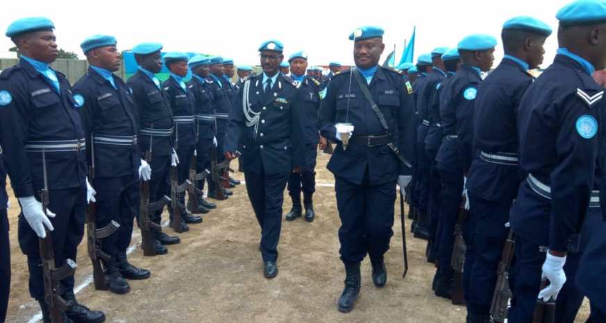 UNPOL Chief-of-Staff, Commissioner Girmay Gebrekidan inspecting a Guard-of-Honour mounted by the decorated Rwandan Police peacekeepers.