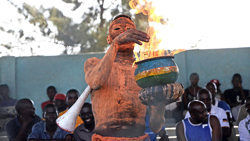 A Bugesera FC supporter lights a fire in a pot during a league tie against Marines last week. The match ended in a 1-1 draw. Sam Ngendahimana.