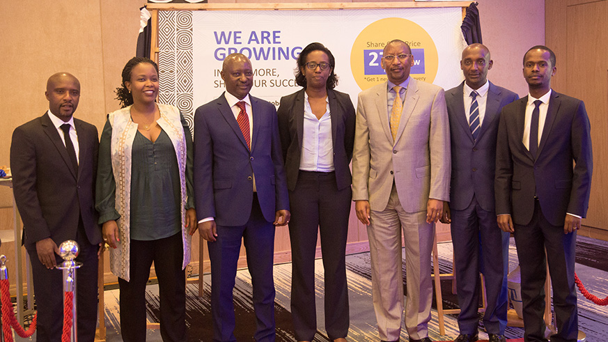 Officials pose for a group photo after the official unveiling of BK Groupu2019s rights issue in Kigali yesterday. The Group issued over 200 million new shares to existing holders of ordinary shares. The trading of the new shares will last 12 days. Nadege Imbabazi.