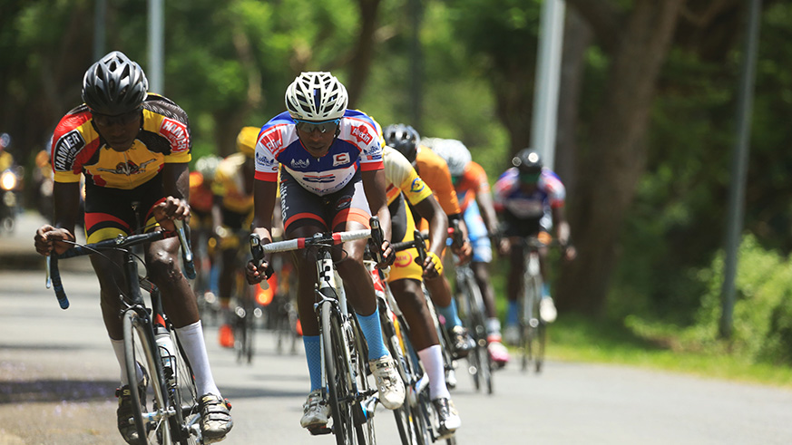 Youngster Moise Mugisha, 21, celebrates his solo victory as he crosses the finish-line in Karongi on Sunday afternoon. Sam Ngendahimana.