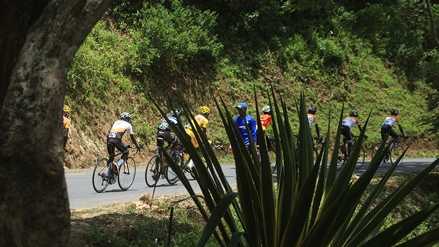 Youngster Moise Mugisha, 21, celebrates his solo victory as he crosses the finish-line in Karongi on Sunday afternoon. Sam Ngendahimana.