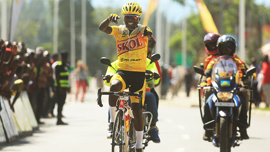 Youngster Moise Mugisha, 21, celebrates his solo victory as he crosses the finish-line in Karongi on Sunday afternoon. Sam Ngendahimana.