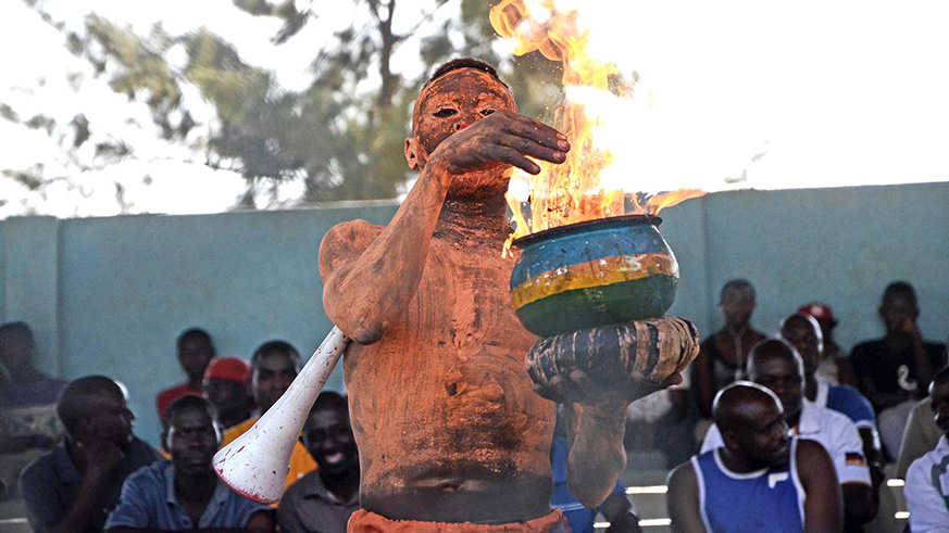 A Bugesera FC supporter lights a fire in a pot during a league tie against Marines last week. The match ended in a 1-1 draw. Sam Ngendahimana.