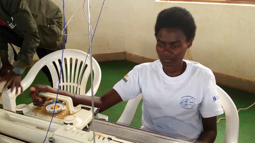 27-year old Penine Niyobyose who is blind makes money from sweater knitting./Michel Nkurunziza