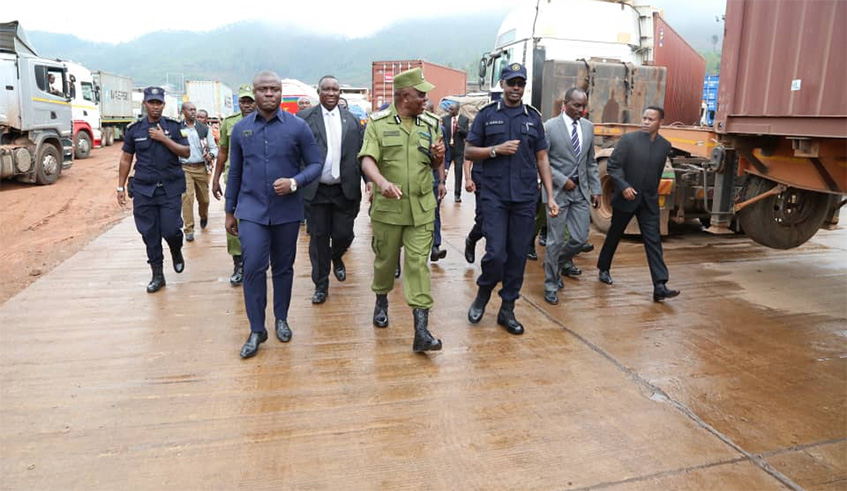 Rwandau2019s Inspector General of Police (IGP) Dan Munyuza (R) and his Tanzanian counterpart Simon N. Sirro (C) at the Rusumo border post where they met yesterday to discuss cross border security. Courtesy.