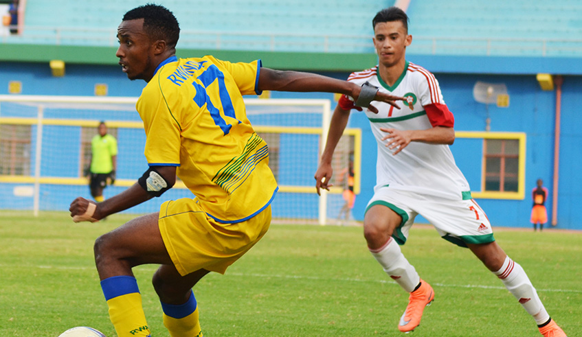 APR winger Dominique Savio Nshuti (with the ball) is the newly appointed Amavubi U23 team skipper. He is seen in action during a past friendly match against Morocco at Amahoro National 