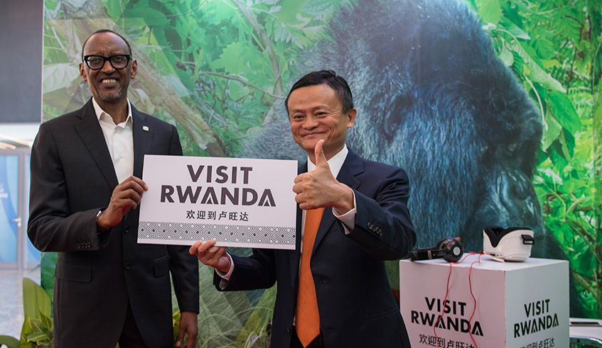  President Kagame and Alibaba Group founder and Executive Chairman Jack Ma pose with a u2018Visit Rwandau2019 logo as they reiterate their commitment to Rwanda and Alibabau2019s partnership in promoting the country as a top tourism destination in Kigali yesterday. The event saw the launch of Electronic World Trade Platform (eWTP) Africa, an Alibaba e-commerce platform u2013 the first of its kind in Africa u2013 which will facilitate Rwandans to transact business with the rest of the world. Village Urugwiro.
