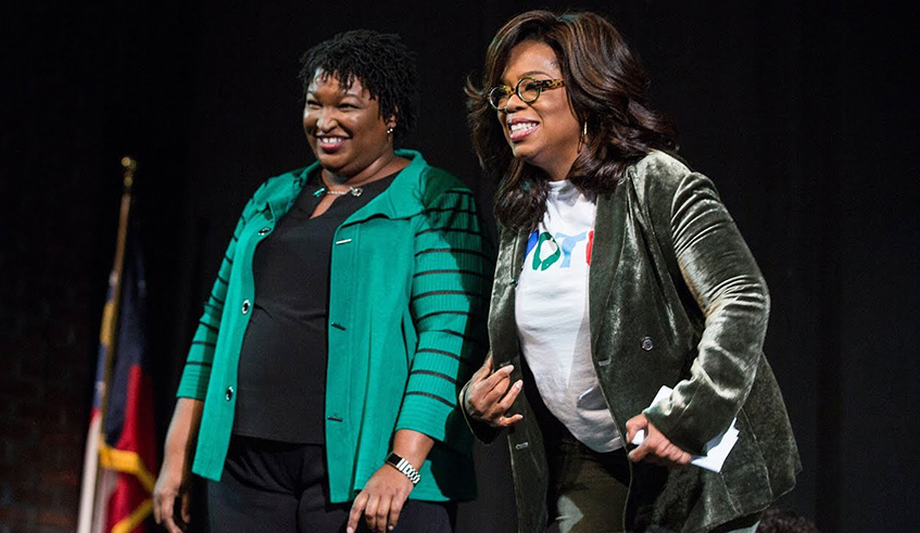 Oprah Winfrey (left) campaigns with Georgia Democrat Stacey Abrams. Net.