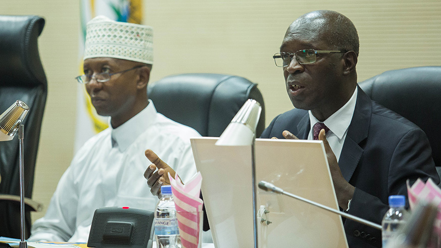 Anastase Murekezi, the Ombudsman (right) presents his officeu2019s 20172018 annual activity report to Parliamentarians. Left is deputy speaker in charge of finance and administration, Musa Fazil Harerimana. Nadege Imbabazi.