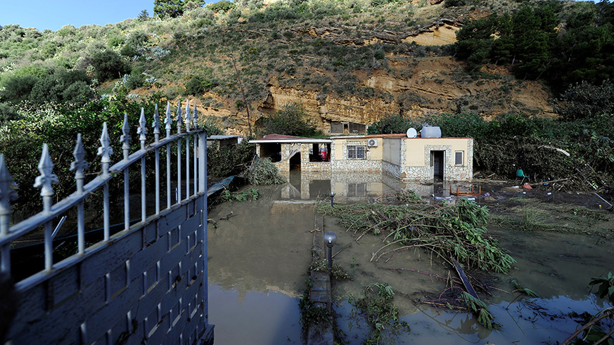 A general view shows a partially submerged house, where according to local media nine people died in, due to the flood-affected river Milicia, in Casteldaccia, near Palermo, yesterday. Net photo.