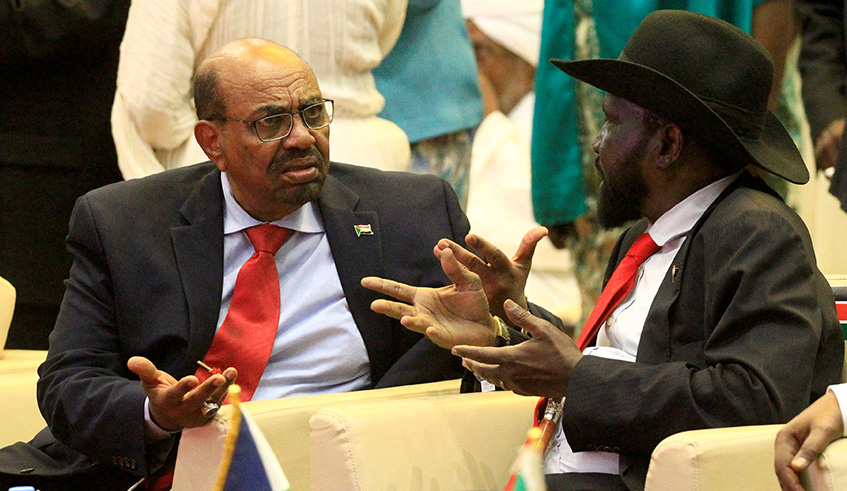 South Sudanu2019s President Salva Kiir (right) talks to Sudanu2019s President Omar al-Bashir after signing a cease fire and power sharing agreement with South Sudanese rebel leader Riek Machar in Khartoum, in August. Net photo.