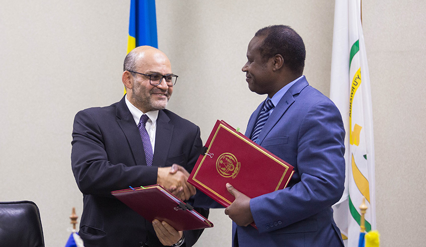A journalist asks a question during the signing ceremony at Ministry of Finance and Economic planning yesterday. Nadege Imbabazi