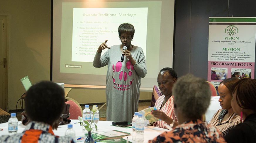 Rose-Marie Mukarutabana explains bridal showers from a traditional perspective.  Below: Elizabeth Rugege (centre) with other participants during the discussion. / Photos by Nadege Imbabazi
