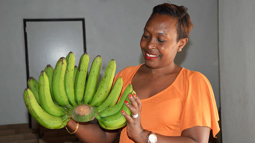 Donatille Nibagwire shows off one of the products that she exports to Europe twice a week . Sam Ngendahimana.