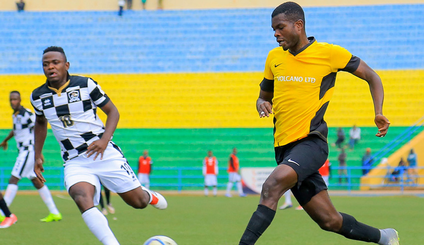 Mukura central defender David Nshimiyimana tries to dribble past APRu2019s forward Muhadjiri Hakizimana during a past league match at Huye Stadium. The two teams will represent the country in CAF competitions this season. File