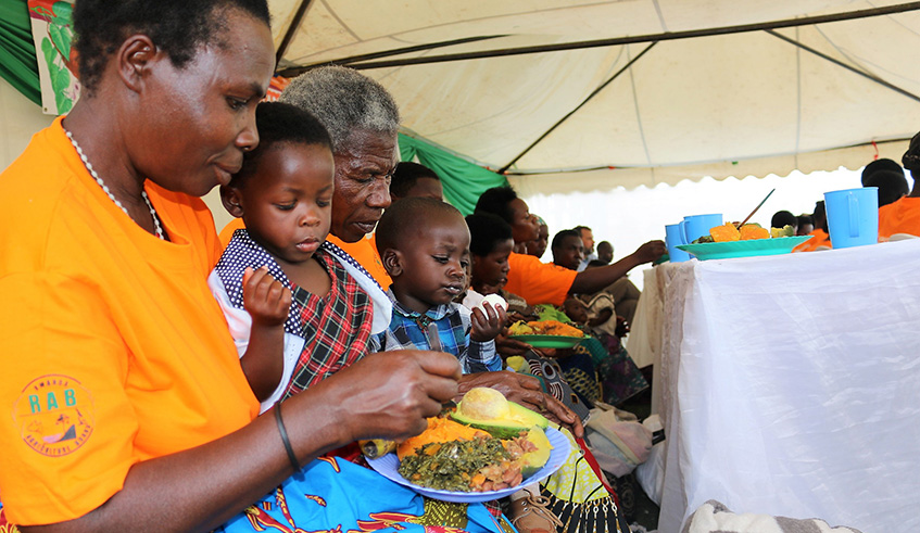 Mothers feed their babies. They are trained on how to feed their children a balanced diet with locally available food.