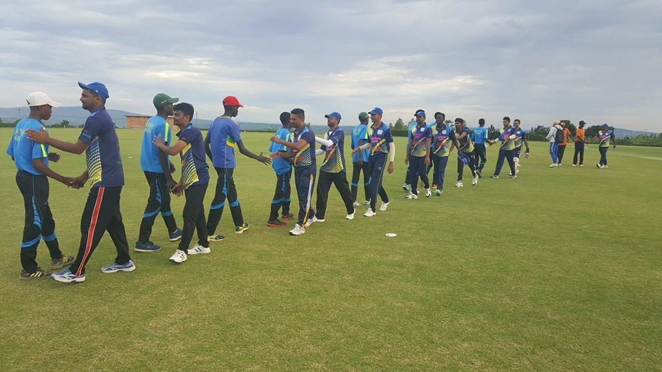 Kutchi Tigers players and their Zonic Cricket Club counterparts shake hands before starting the game at Gahanga Cricket Stadium on Sunday. Courtesy
