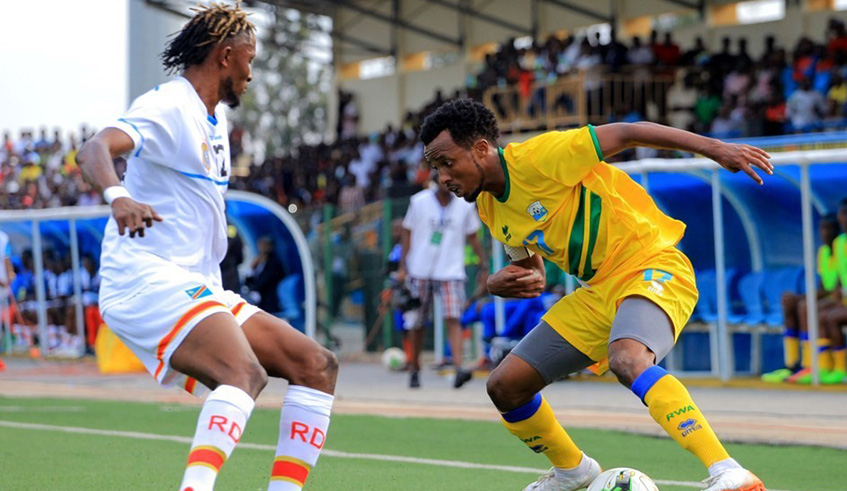 Amavubi U23 skipper Dominique Savio Nshuti (right) attempts to dribble past DR Congo defender Dieu-Merci Mukoko Amale in the first-half during the 0-0 draw at Umuganda Stadium in Rubavu on Wednesday. Courtesy.