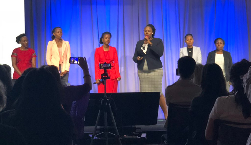The winners after being awarded for their impact project.  Below: (From left to right) Kayirangwa, Uwera,Nibakuze, Mugwaneza, Munezero and Uwizeye explain their idea about helping women genocide survivors. Courtesy photos