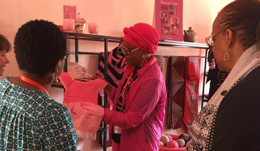 Kibugu showing visitors around the wellness centre. 