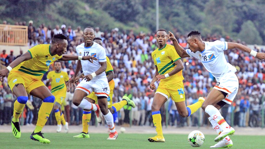 DR Congou2019s Alidor Kayembe (on the ball) tries to penetrate through the Rwandan defence during the two sidesu2019 goalless draw at Umuganda Stadium on Wednesday. Courtesy.