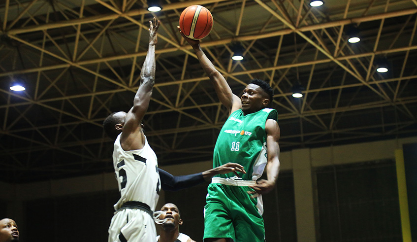 Espoir Basketball Club u2018s Espoir Iganze goes in for dunk during the pre-season match against Patriots in Kigali on Friday. Sam Ngendahimana.