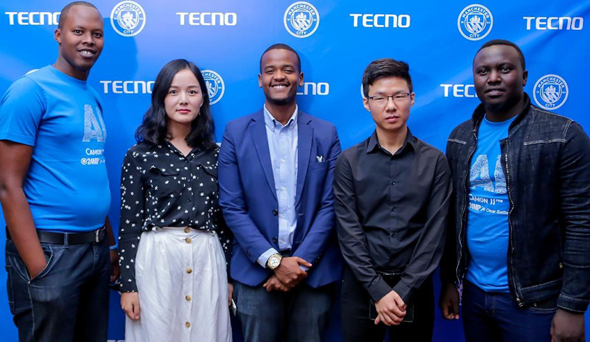 TECNO Rwanda CEO Mr. Kelvin Zeng (2nd right) and the companyâ€™s Brand Manager, Miss Vicki (2nd left), during the launch of new Tecno Camon 11.
