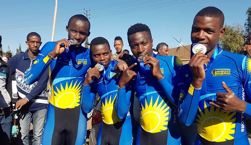 From L-R: Samuel Mugisha, Eric Manizabayo, Didier Munyaneza and Moise Mugisha. Team Rwanda riders show off their silver medals after finishing second in menu2019s Team Time Trial (TTT) in Asmara, Eritrea on Wednesday. Courtesy.