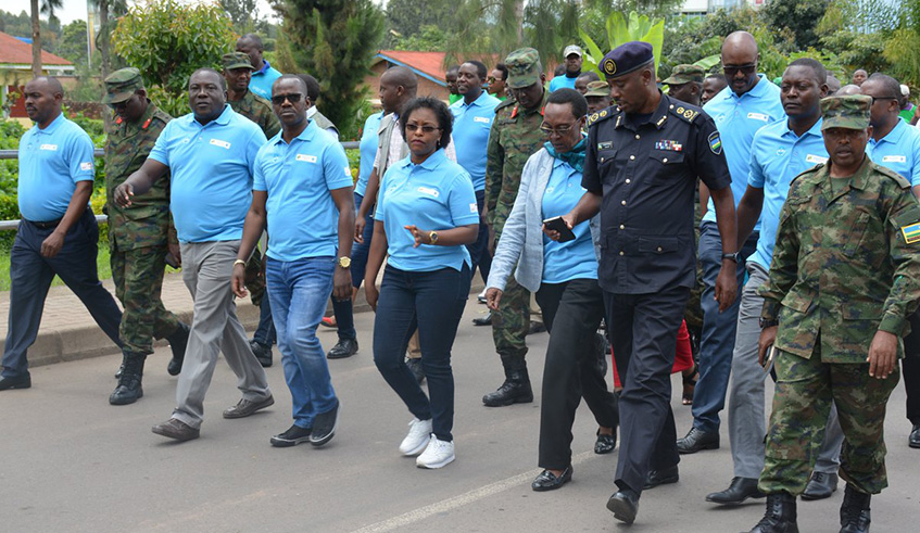 Officials and Musanze residents during a walk before the launch of the RIB service charter. Regis Umurengezi