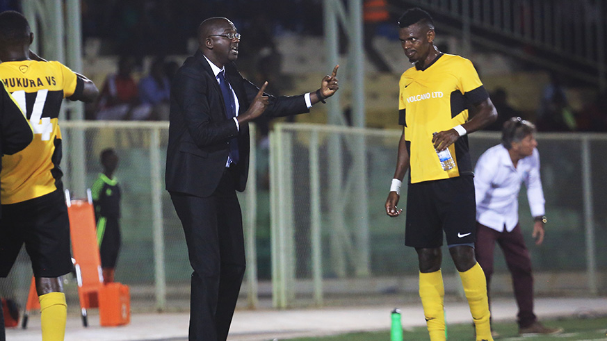 Mukura Victory Sports head coach Christian Francis Haringingo gives instructions to one of his players during the Peace Cup final against Rayon Sports at Kigali Stadium on August 12. Sam Ngendahimana.