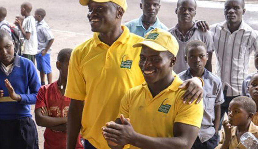 Tharcisse Kamanda (smiling on the left).File