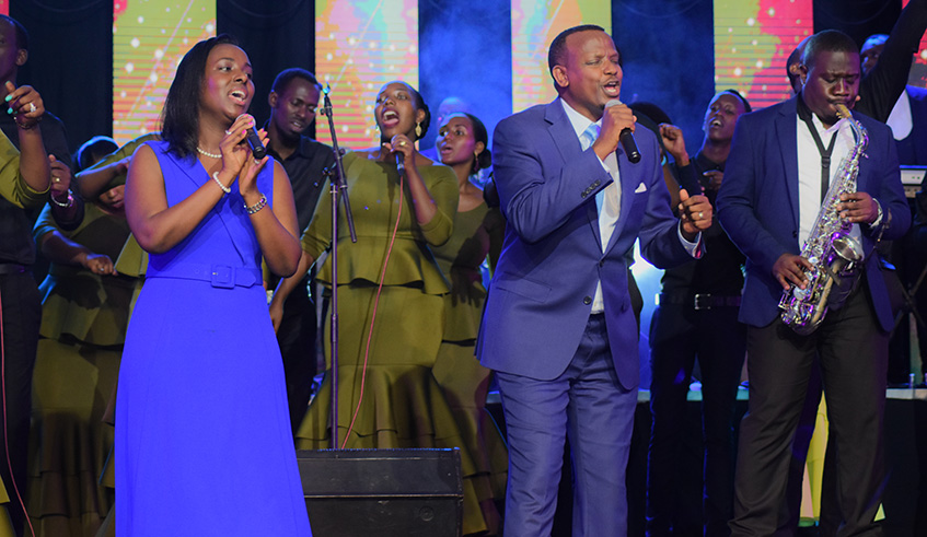 Amani Stephan (centre)and his wife Aime Nyakiray perform with a band.