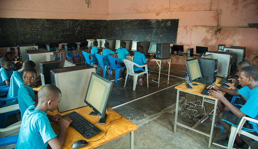 Pupils operate computer at Mu00e8re du Verbe Primary school in Gasabo District. Nadege Imbabazi.