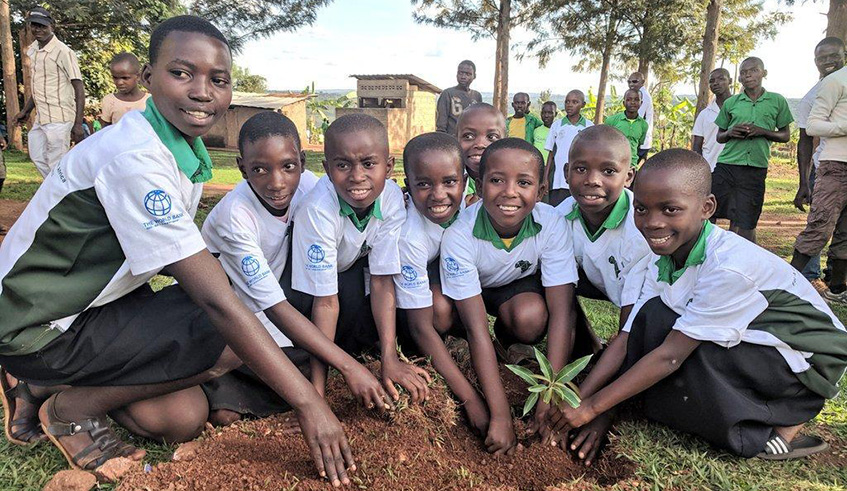 Pupils of Kigusa Primary School in Bugesera District plant a tree yesterday. The exercise was part of the activities lined up as part of the ongoing Africa Green Growth Forum that opened in Kigali yesterday. Courtesy.