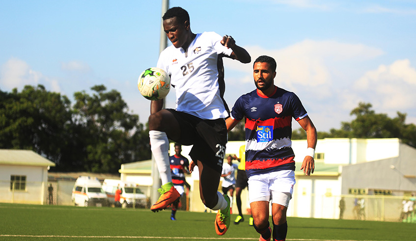 APR right-back Fitina Omborenga controls the ball under pressure from Club Africain defender Ali Abdi during the two sidesu2019 goalless draw at Kigali Stadium on Wednesday. Sam Ngendahimana.