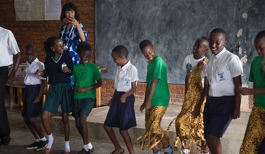Excited students dancing at the event.