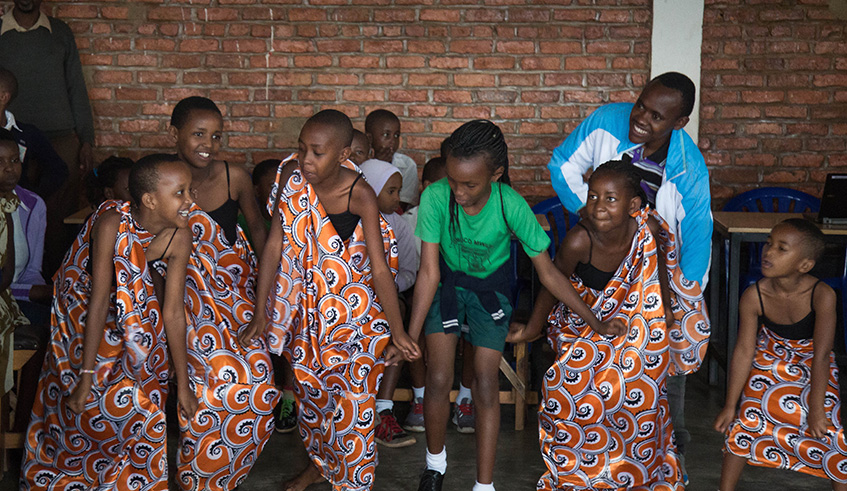 School children showcase Rwandan dance, while clad in traditional dresses during the workshop at Umuco Mwiza School on Wednesday. Photos by Nadege Karemera.