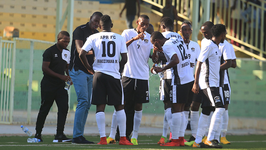 APR FC head coach Jimmy Mulisa talks to his players during the goalless draw against Club Africain at Kigali Stadium on Wednesday. Sam Ngendahimana.